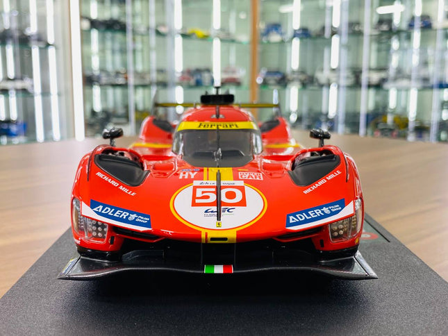 Bburago Ferrari 499P #50 24h Le Mans 1:18 Diecast Model Car Red Yellow - studio product photo of the scale model