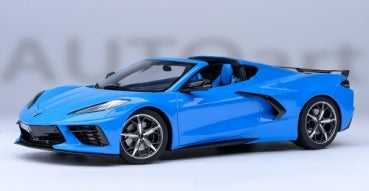 1:18 scale blue diecast model sports car with detailed rims and open-top design