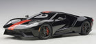 Black 1:18 scale diecast model car with red racing stripe, detailed sports car design
