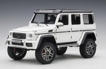 White diecast Mercedes-Benz G-Class SUV model car with black roof in 1:18 scale