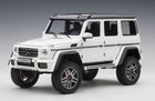 1:18 scale white Mercedes-Benz G-Class diecast model car with black roof and detailed wheels
