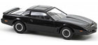 Black diecast model car 1:18 scale, classic sports coupe with rear spoiler on white background