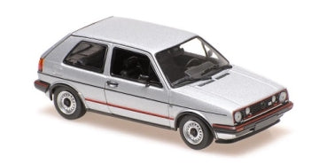 Silver diecast model car in 1:18 scale, hatchback with red accents, detailed wheels