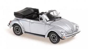 Silver diecast convertible model car with black interior and detailed wheels, 1:18 scale.