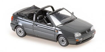 1:18 scale diecast model of a black Volkswagen Golf convertible car with detailed interior