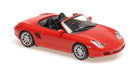 Red diecast convertible model car, 1:18 scale, detailed interior and wheels, isolated on white
