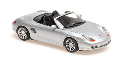 Silver 1:18 scale diecast Porsche convertible model car with detailed wheels and interior