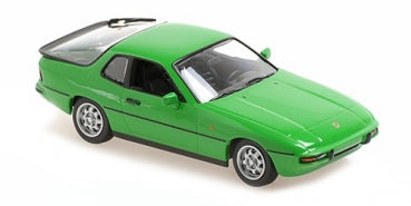 Green diecast Porsche model car in 1:18 scale, detailed sports coupe design