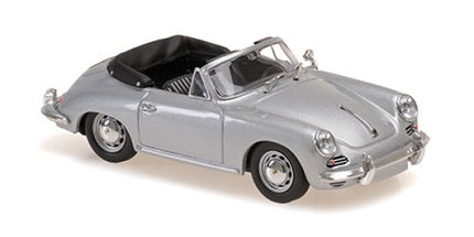 silver diecast convertible model car with black interior, 1:18 scale