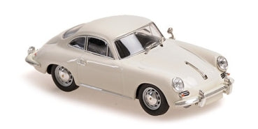 White diecast model car in classic coupe design, 1:18 scale collectible.
