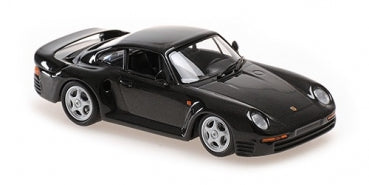 Black diecast Porsche model car in 1:18 scale with detailed wheels and rear spoiler
