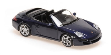 1:18 scale diecast Porsche model car in dark blue convertible style on white background