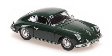 Green diecast model car 1:18 scale classic coupe with chrome detailing on white background