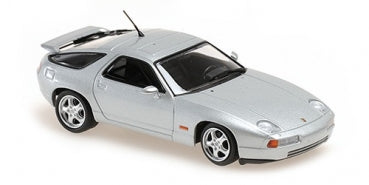 Silver diecast Porsche 928 model car 1:18 scale, detailed wheels and black trim, side view