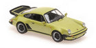 Green diecast Porsche 911 Turbo 1:18 scale model car with black accents on white background