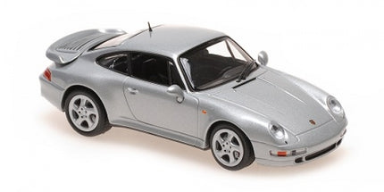 Silver Porsche diecast model car 1:18 scale with rear spoiler and detailed wheels