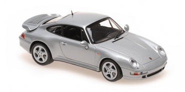 1:18 scale silver Porsche diecast model car with rear spoiler on white background