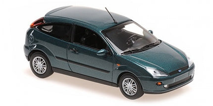 1:18 scale diecast model car in metallic green, three-door hatchback, detailed wheels