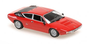 Red 1:18 scale diecast model sports car with black roof detail, viewed from above