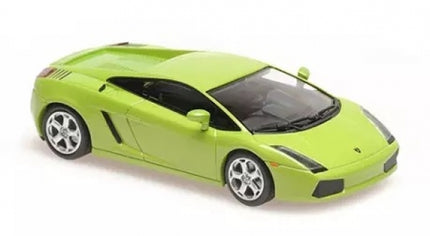 Green 1:18 scale diecast model sports car with silver wheels, displayed on white background