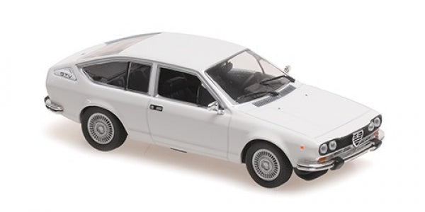White diecast model car coupe with detailed wheels and interior, 1:18 scale