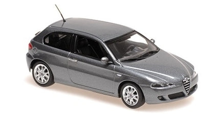 1:18 scale diecast grey hatchback model car with detailed wheels and sleek design