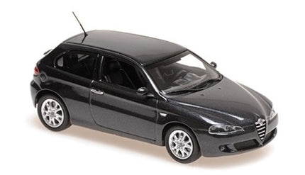 Black diecast Alfa Romeo model car 1:43 scale with detailed exterior, side angle view