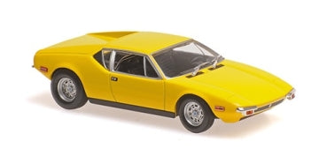 Yellow diecast model car in 1:18 scale with sporty coupe design on white background