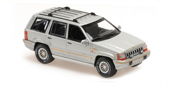Silver diecast SUV model car in 1:43 scale with detailed roof rack and wheels