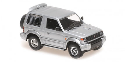 1:43 scale silver diecast Mitsubishi Pajero SUV model car, detailed exterior