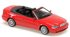 Red diecast convertible model car in 1:18 scale with black interior, top down.