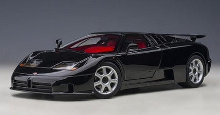 Black diecast model car with red interior, sports coupe design, 1:18 scale