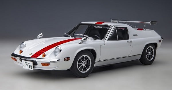 White diecast model sports car with red racing stripes, rear wing, and Japanese license plate