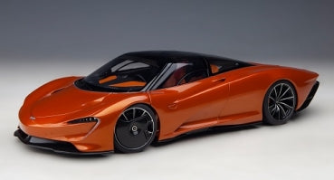 1:18 scale orange diecast model car with black roof and sleek aerodynamic design
