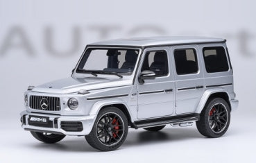 1:18 scale silver diecast Mercedes-AMG G-Class model car with black wheels and red brake calipers