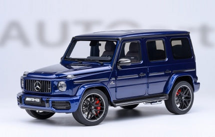 1:18 scale blue Mercedes AMG G-Class diecast model car with black wheels and red brake calipers