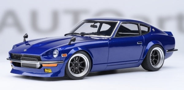 1:18 scale blue diecast model car with black wheels, classic coupe design, detailed exterior