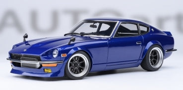 1:18 scale blue diecast classic sports car model with detailed wheels and chrome accents