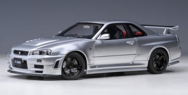 1:18 scale silver diecast model car with black wheels and rear spoiler, sports coupe style