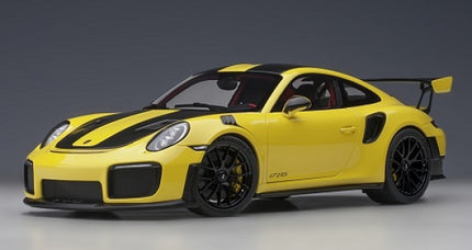 Yellow and black 1:18 scale Porsche GT2 RS diecast model car with detailed exterior