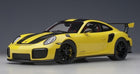 Yellow and black 1:18 scale Porsche GT2 RS diecast model car with detailed exterior