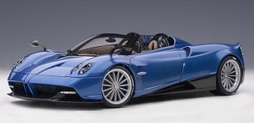 Blue 1:18 scale diecast model sports car with detailed interior and alloy wheels