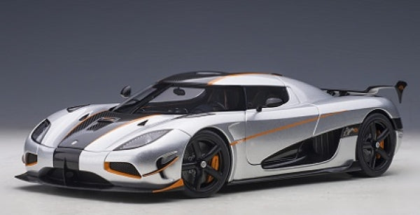 Silver and black Koenigsegg diecast model car with orange accents, 1:18 scale