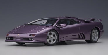 Purple diecast model car Lamborghini Diablo in 1:18 scale on gray background