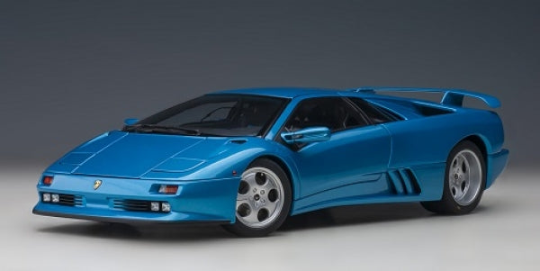Blue diecast model sports car in 1:18 scale, detailed Lamborghini design, studio background