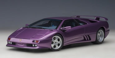 Purple diecast model sports car with rear spoiler, detailed wheels, and sleek design