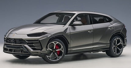 Diecast 1:18 scale grey Lamborghini Urus model car with red brake calipers