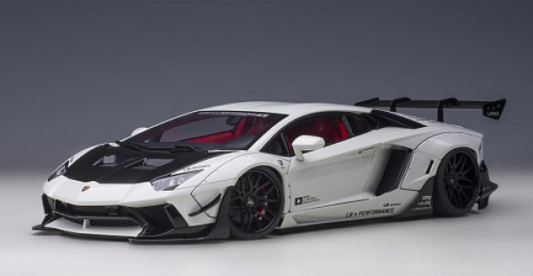 1:18 scale white Lamborghini Aventador diecast model car with black details and rear wing