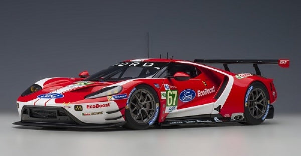 1:18 scale Ford GT race car diecast model, red and white with racing decals and rear spoiler