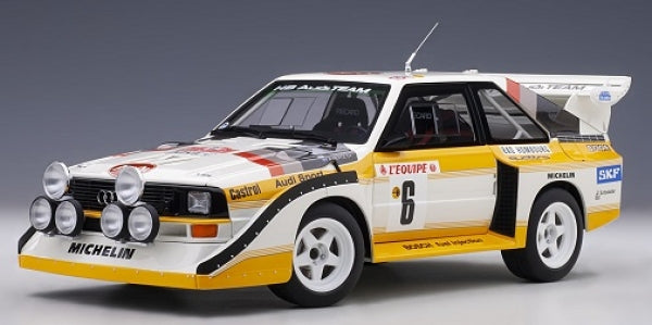 1:18 scale diecast model rally car with white, yellow, and black livery, detailed decals